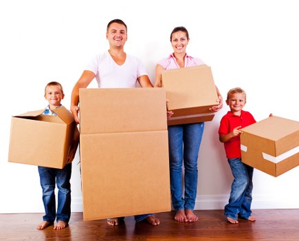 Removal team using safe lifting practices during a move