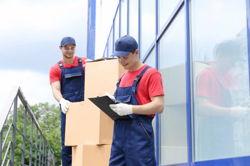 Careful moving of sofas and large furniture in a West London property