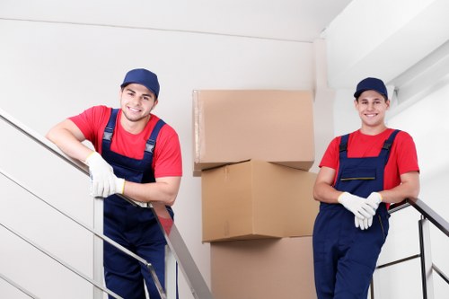 Student removals team helping with boxes and furniture in Holland Park