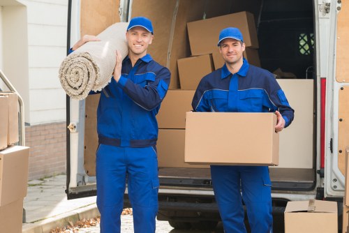Office and home removal preparation with boxes, labels, and furniture protection