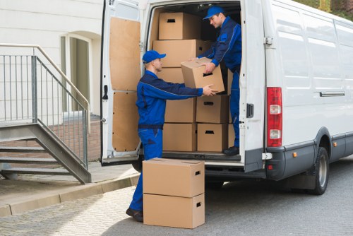 Careful loading of student belongings for a move in Holland Park