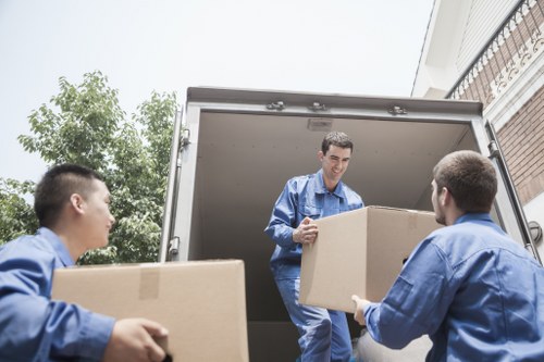 Local moving van serving residential streets in Holland Park