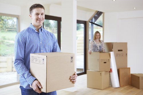 Careful loading of boxes and furniture into a removal van service