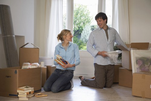 Careful loading of office furniture during a Holland Park collection