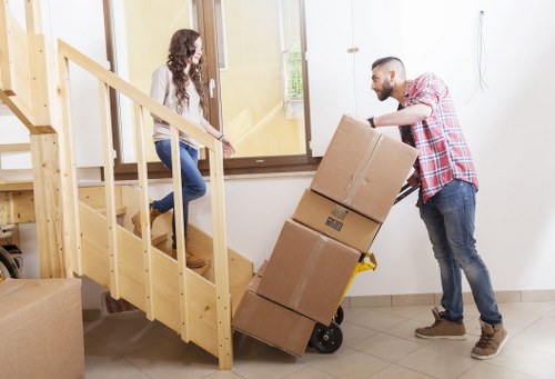 Professional movers handling IT equipment during an office move