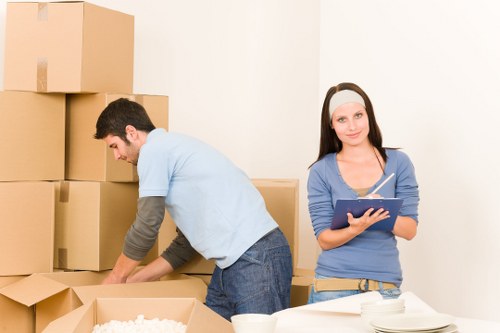 Household furniture and packed boxes ready for collection by removal van