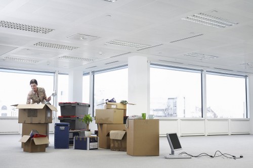 Office furniture being delivered and placed in a new Holland Park workspace