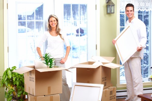 Office desks and equipment being handled carefully during a commercial relocation